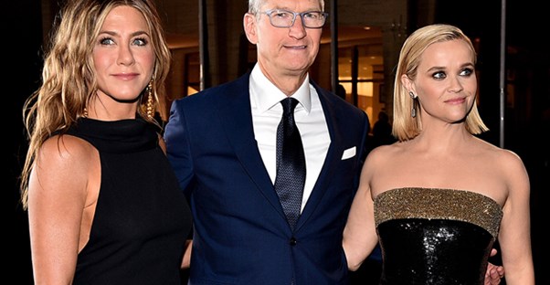 Tim Cook, the CEO of Apple, with Jennifer Aniston and Reese Witherspoon