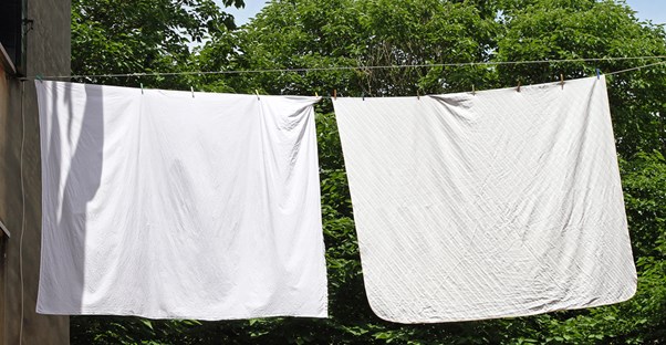 hanging bed sheets have been cleaned and rid of bed bugs