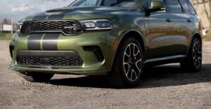 a green 2021 dodge durango in a parking lot