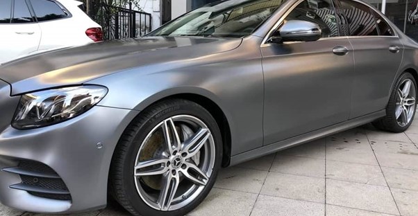 a 2019 dark gray mercedes benz e class sedan