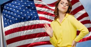 smug woman in front of flag