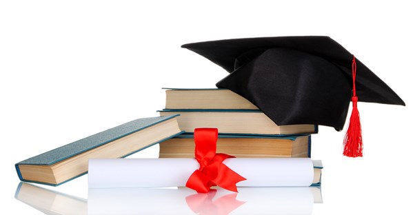 graduation cap and books