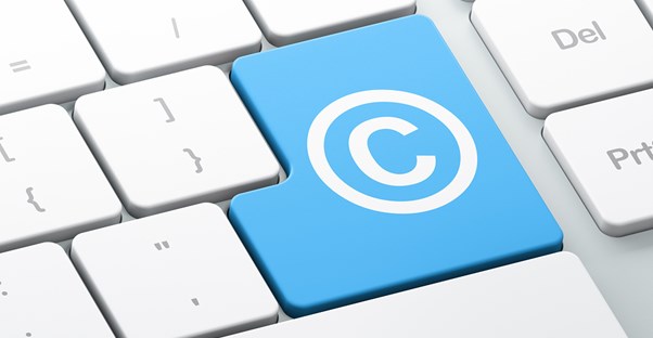 computer keybord key with the copyright symbol on it