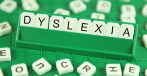 lettered tiles spelling out dyslexia
