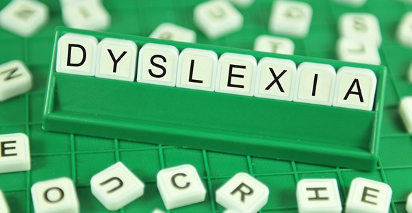 lettered tiles spelling out dyslexia