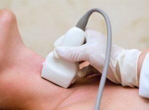 patient having throat examined by ultrasound