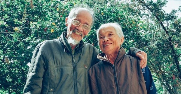 happy older couple hugging and smiling