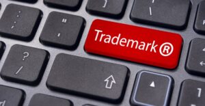 a key on a keyboard labeled trademark
