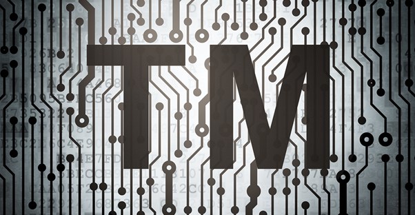 they trademark symbol over a stylized computer chip circiutry background