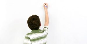 a dyslexic boy attempting to write