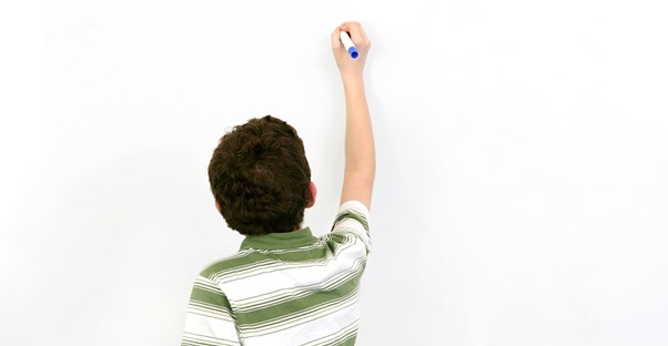 a dyslexic boy attempting to write