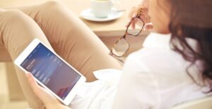 a woman viewing mobile banking options on her tablet