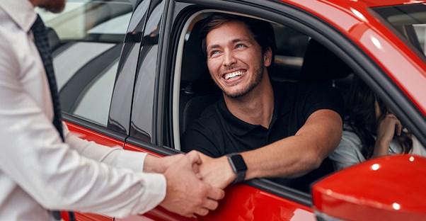 a customer haggling with a salesperson over a new car