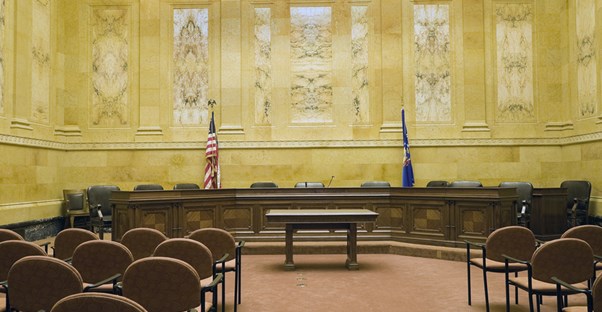 a courtroom where people with juris doctor degrees use legal terminology