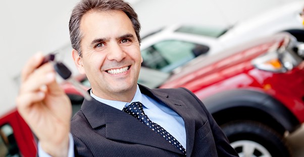 a pushy car salesman holding a key