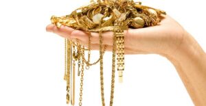 a handful of gold with varying karat values