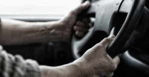 a truck driver steering a vehicle