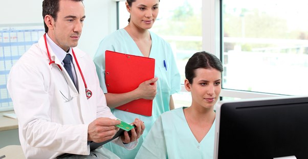 medical assistants helping a doctor