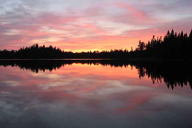 Sunset Behind the Forest Lake