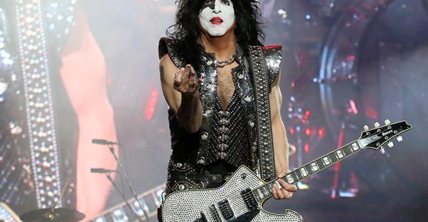 a kiss band member rocks out on stage