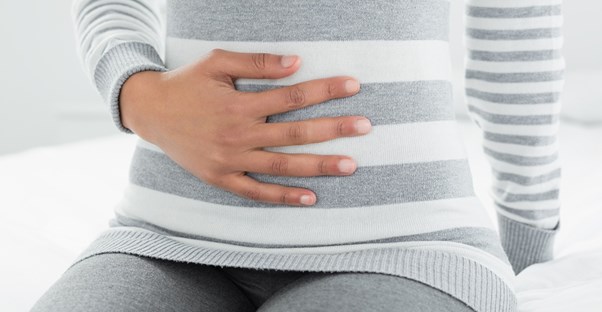 a woman suffering from gastroesophageal reflux disease