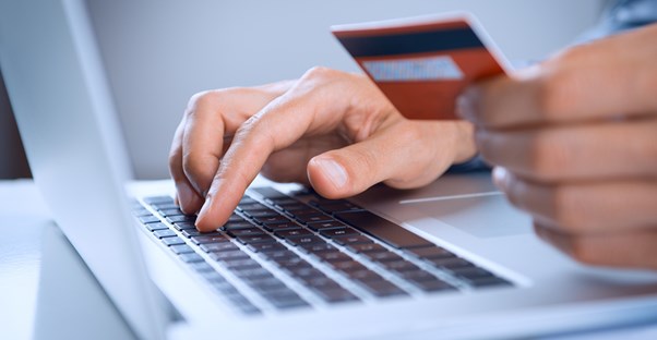 Man enters credit card information in unsecure personal finance software