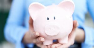 Piggy bank containing savings of prepared personal finance software user