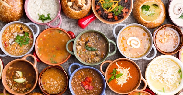 flat lay of different soups in bowls