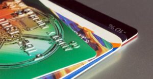 5 travel credit cards fanned out on a table