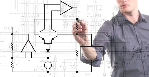 Male engineer outlines plan on board