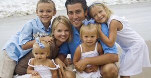 Adorable photo of a family at the beach