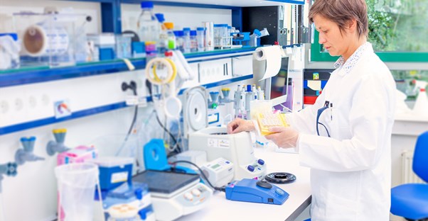 Pharmacist using her previous education to fill prescriptions