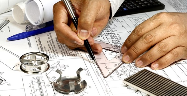 Aspiring mechanical engineer working on a design in a mechanical engineering internship