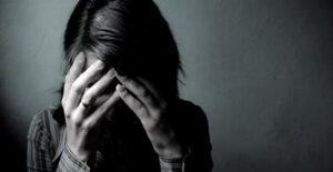 a woman with alcoholism is in deep emotional turmoil