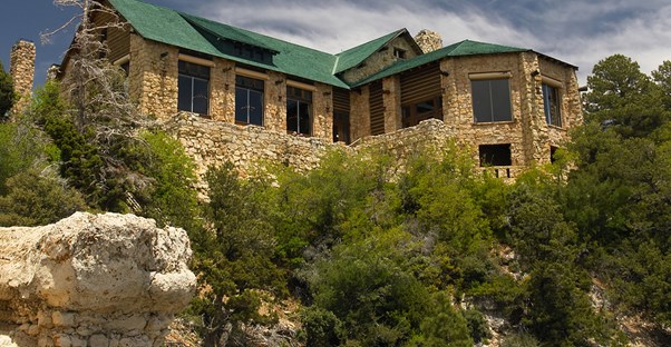 a hotel sits on the edge of the Grand Canyon