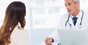 a doctor explaining possible syphilis treatments to a patient