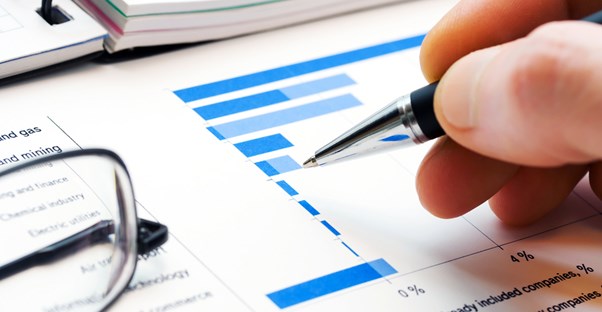 Close up of hand following an asset management graph