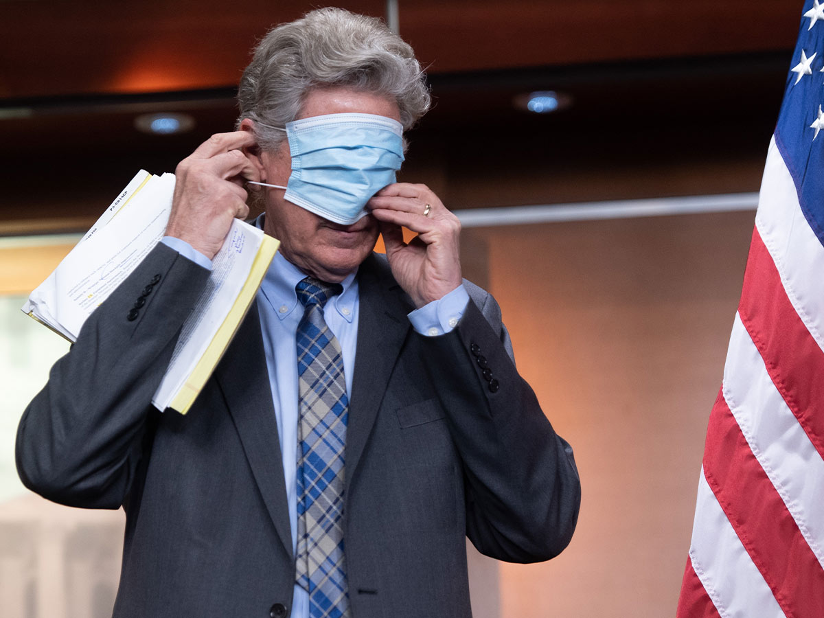Rep. Frank Pallone Putting on a Mask at a COVID Briefing