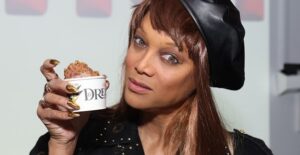 tyra banks with a sample of her smize and dream ice cream