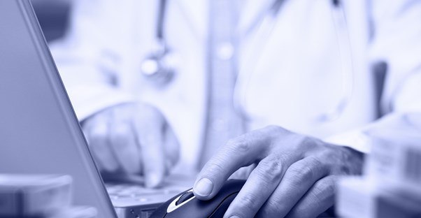 a doctor comparing a patient's electronic medical record to a personal health record