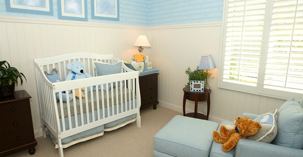 a newly decorated nursery awaits its future inhabitant