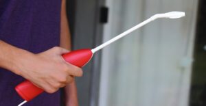 a man holds a weed repellent sprayer