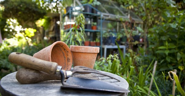 empty pots and a spade await new plants