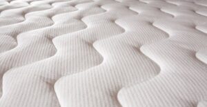 a close up of a pattern sewn into a mattress