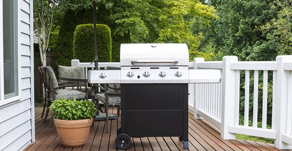 a new grill sits on the back porch
