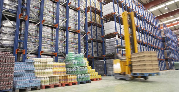 A warehouse full of inventory being tracked by inventory management software.