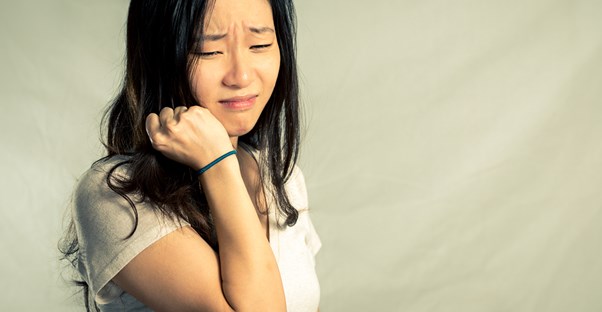 a woman suffering from the health effects of bullying