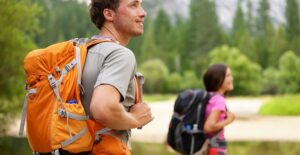 a man and woman enjoy a hiking trail in yosemite national park