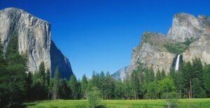 a picturesque view of a waterfall in yosemite national park