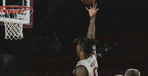 a college basketball player attempts a dunk during the ncaa mens basketball tournament